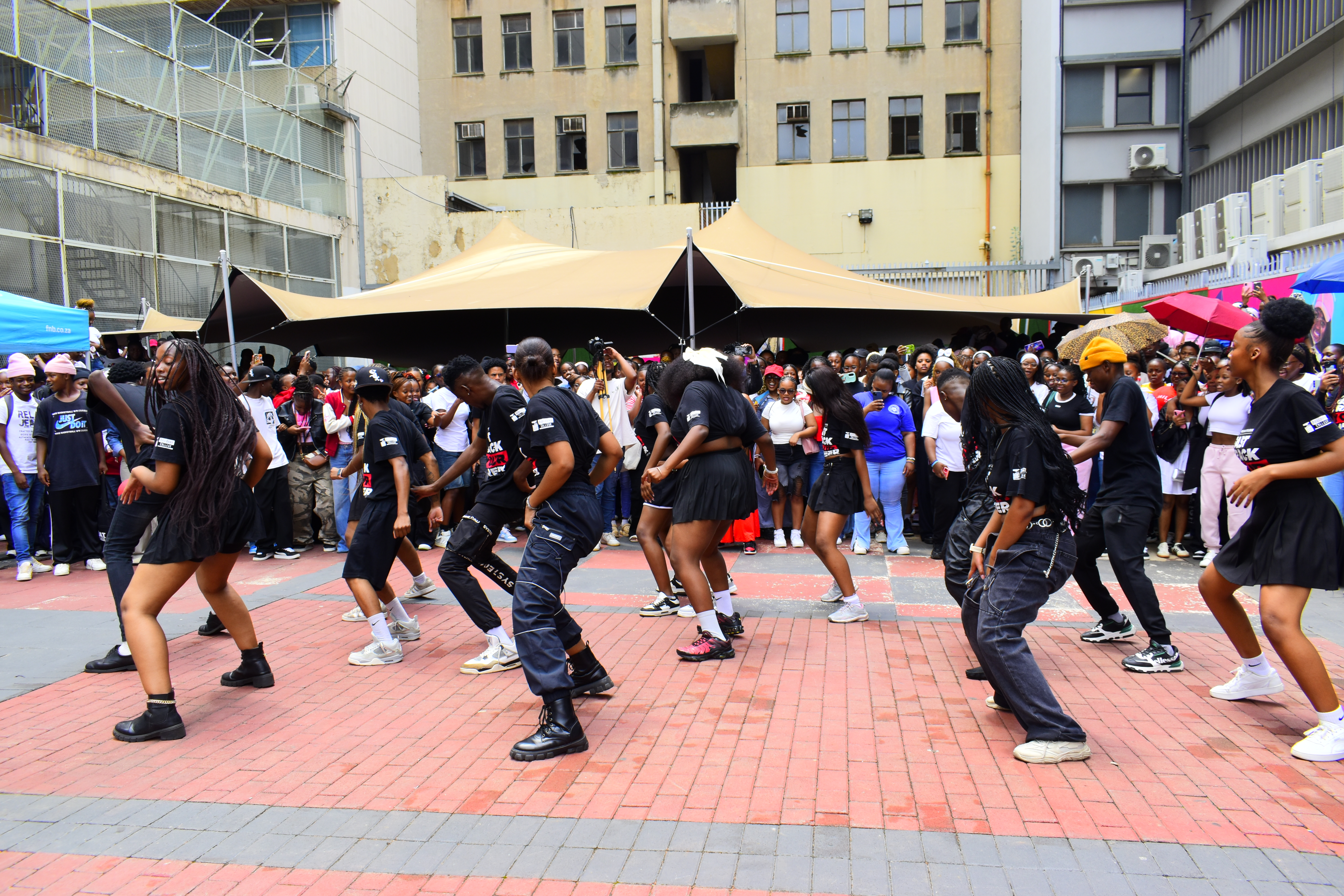 Lively crowd photography tracking a live performance festival.